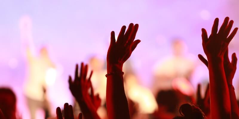 People praising God with hands raised