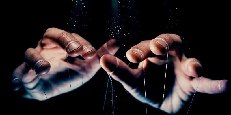 hands with puppet strings